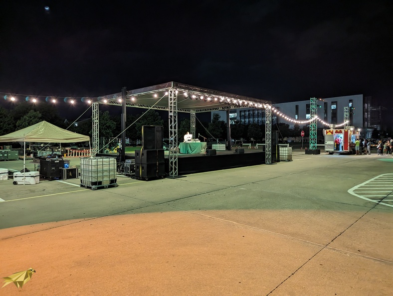 This outdoor event requested a band stage with lighting to draw a crowd and attract them to outdoor food trucks with a DJ performing late into the evening. bulb patio stringers with stage.jpg