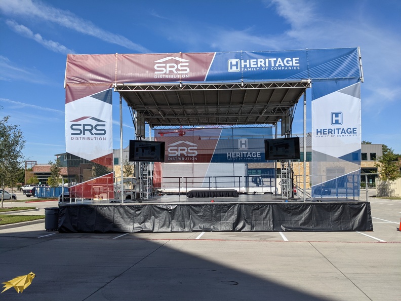 On this stage we really wanted to get people's attention from far off. A full banner package of custom prints spans the stage wings an overhead. You can't help but notice this is the main attraction. SL-100 with full banner package.jpg