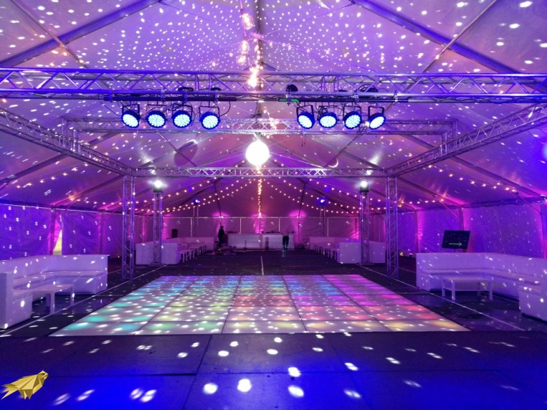This tent is build over an uneven outdoor surface using our stage sub-floor and has an LED Dance Floor in the center. Lighting is suspended on a full box truss. Truss Box - Rack Lighting.jpg